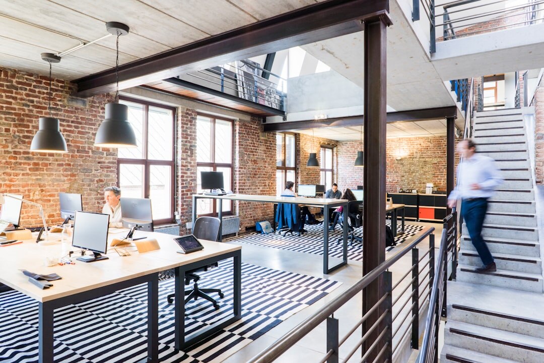 Modern startup office with people working on laptops